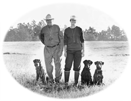 Trainers John and Amy Dahl with retrievers